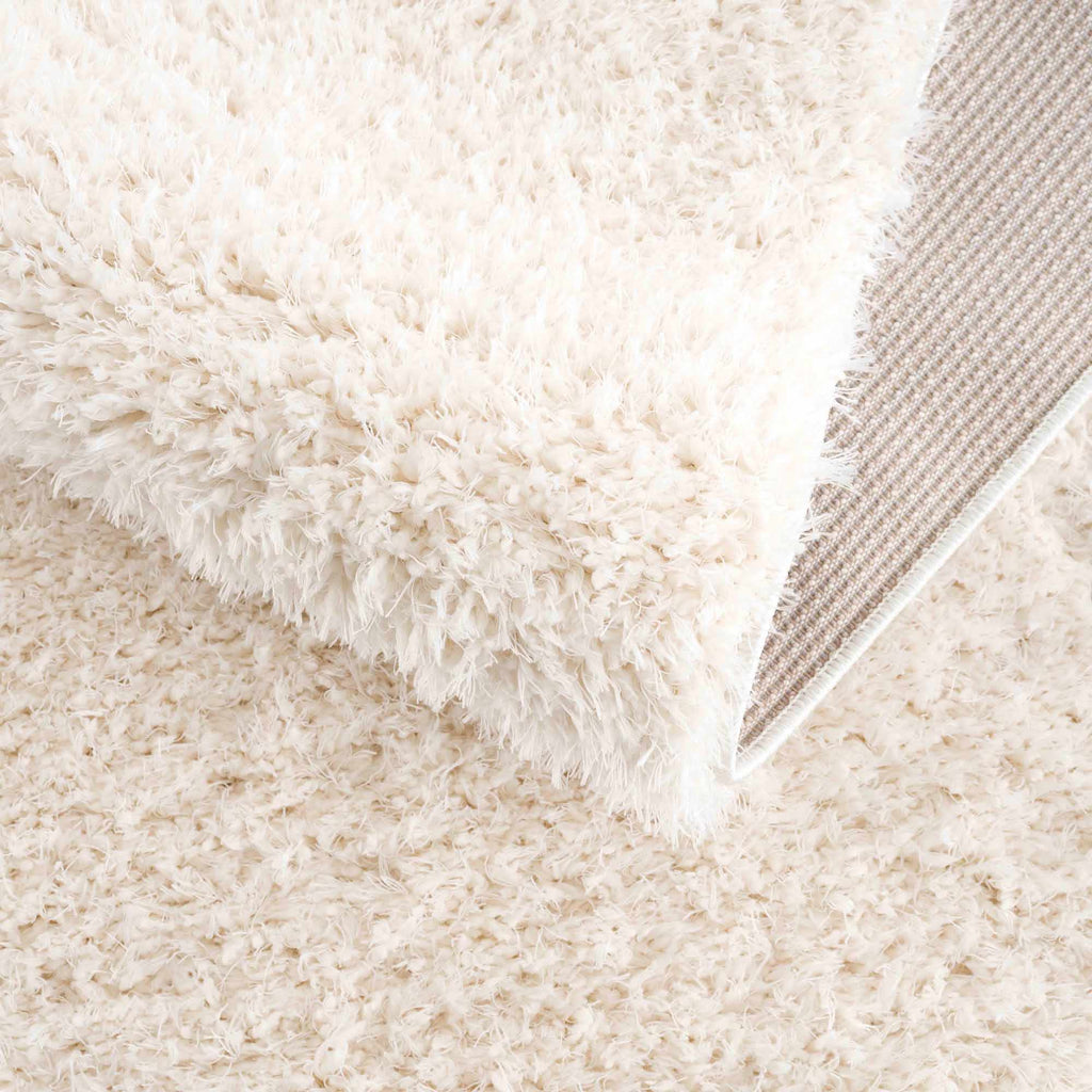 Faina Solid Cream Shag Washable Area Rug - Clearance